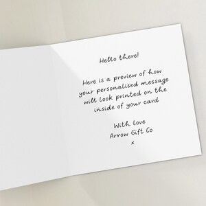 May include: A white card with a handwritten message that says "Hello there! Here is a preview of how your personalised message will look printed on the inside of your card. With love Arrow Gift Co X".