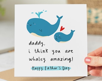 Puede incluir: Una tarjeta blanca con una ballena azul y una ballena azul más pequeña con un corazón rojo. La tarjeta dice "Papá, creo que eres increíblemente genial! Feliz Día del Padre."