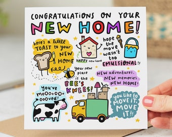 May include: A colorful greeting card with a cartoon illustration of a house, a bee, a cow, a truck, and a paint can. The card says "Congratulations on your new home!" and includes phrases like "Happy new home", "New adventures", and "You've moooved!"