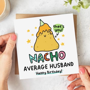 May include: A white card with a cartoon illustration of a nacho chip wearing a party hat. The text reads "That's you! Nacho Average Husband. Happy Birthday!"