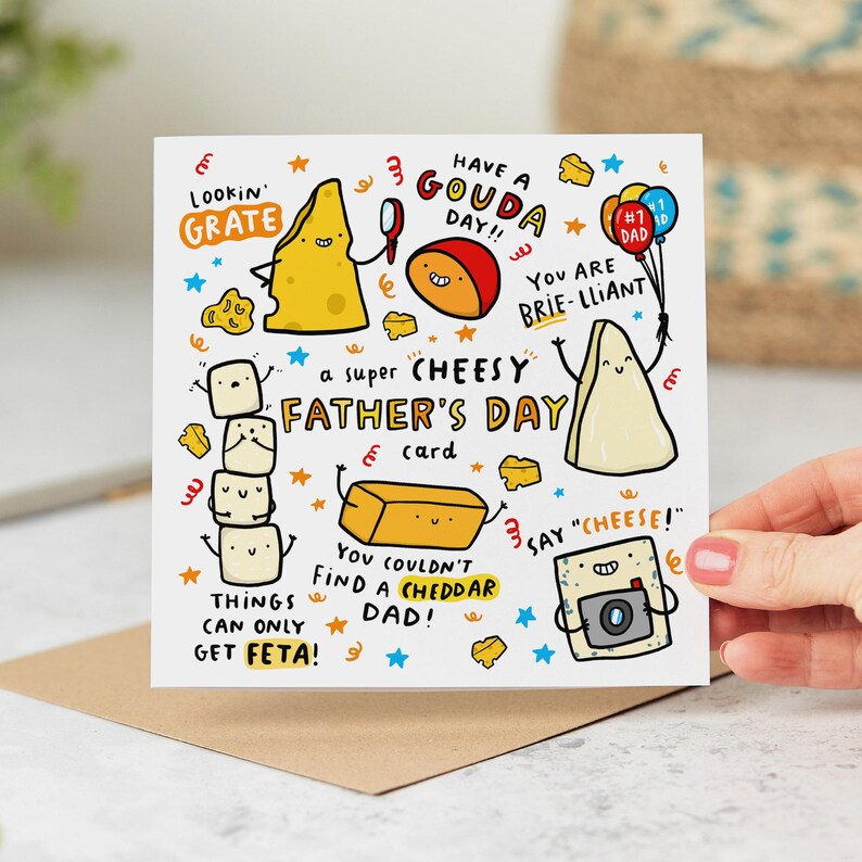 May include: A Father's Day card with a whimsical cheese theme. The card features cartoon cheese characters with puns like "Lookin' Grate" and "Have a Gouda Day!!" The text reads "a super CHEESY FATHER'S DAY card".