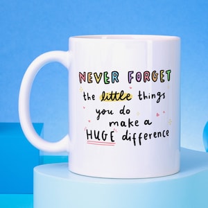 May include: White ceramic mug with a colourful quote that reads "NEVER FORGET the little things you do make a HUGE difference".
