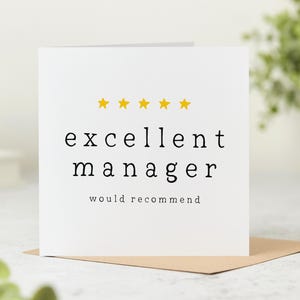 May include: A white card with the words "excellent manager" in black, with five yellow stars above. The phrase "would recommend" is printed below. The card is on a brown envelope.