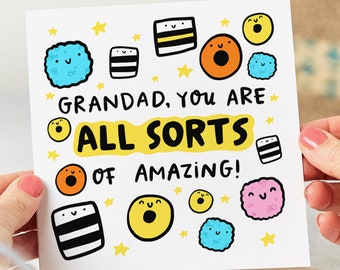 May include: A white card with a colorful illustration of candy and stars. The text on the card reads "Grandad, you are all sorts of amazing!"