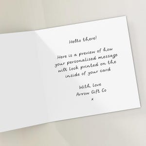 May include: A white greeting card with the text "Hello there!" and a preview of a personalized message. The card includes the text "With Love Arrow Gift Co x".