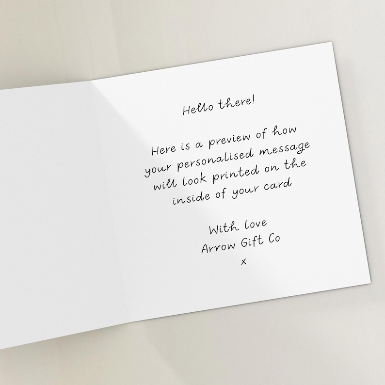 May include: A white greeting card with the text "Hello there!" and a preview of a personalized message. The card includes the text "With Love Arrow Gift Co x".