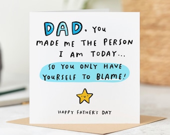 May include: A white Father's Day card with the text "DAD. You MADE ME THE PERSON I AM TODAY... SO YOU ONLY HAVE YOURSELF TO BLAME!" in black and blue lettering. A yellow star is below the text, and "HAPPY FATHER'S DAY" is at the bottom.