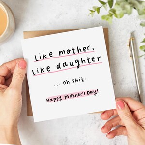 Square white Mother's Day card with black text and pink highlights reading Like mother, Like daughter... oh shit Happy Mother's Day