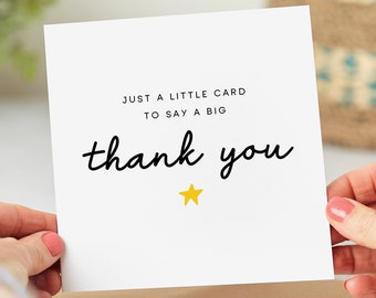 Puede incluir: Una tarjeta blanca con texto negro que dice "Just a little card to say a big thank you" con una estrella amarilla debajo del texto.