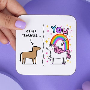 May include: White coaster with a black outline. The left side shows a brown horse with the text "other teachers..." above it. The right side shows a white unicorn with a rainbow behind it and the text "you" above it.