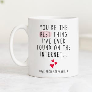 May include: White ceramic mug with black text that reads "You're the best thing I've ever found on the internet..." with three red hearts below the text and the words "Love from Stephanie X" at the bottom.