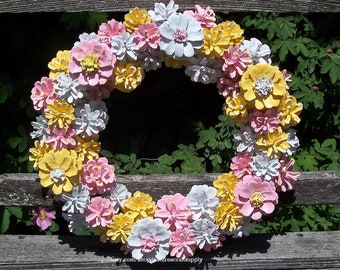 Pine Cone Wreath in pink, yellow, and white with Pine cone flowers.