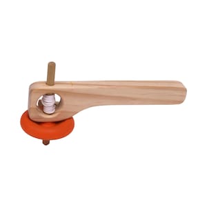 May include: A wooden spinning top with a orange rubber base and a wooden handle. The top is wound with string and can be spun by pulling the string.