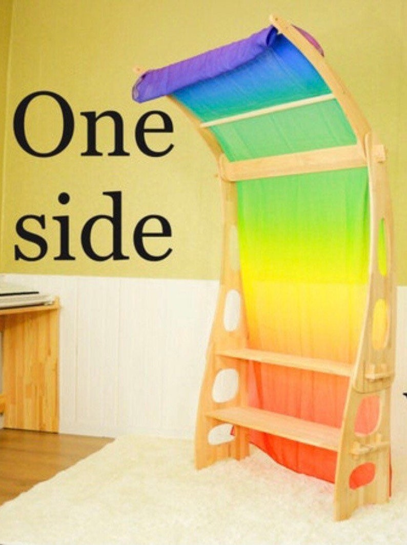 May include: A wooden playhouse with a rainbow-colored fabric canopy. The playhouse has three shelves and is made of natural wood. The text "One side" is visible in the image.