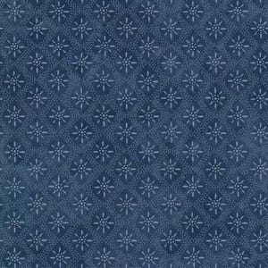 May include: A repeating pattern of light blue starbursts and small dots on a dark blue background. The design is evenly spaced, creating a textured, all-over pattern. The fabric has a slightly faded appearance.