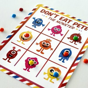 May include: A game board with the title "Don't Eat Pete - The Monster". The board is divided into a 3x3 grid with colorful monster illustrations in each square.  Each monster has a different colored candy on its nose.