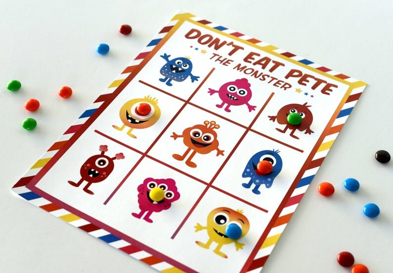 May include: A game board with the title "Don't Eat Pete - The Monster". The board is divided into a 3x3 grid with colorful monster illustrations in each square.  Each monster has a different colored candy on its nose.