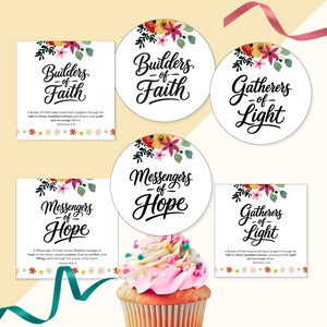 May include: A collection of square and circular paper cards featuring floral illustrations and black script text reading Builders of Faith, Gatherers of Light, and Messengers of Hope, displayed alongside a cupcake with pink frosting and sprinkles.