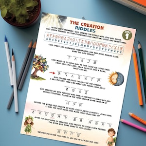 May include: A printed sheet titled "The Creation Riddles" with puzzles and illustrations. The design includes a tree, sun and moon, and cartoon figures. Colour pencils and a small plant are in the background.
