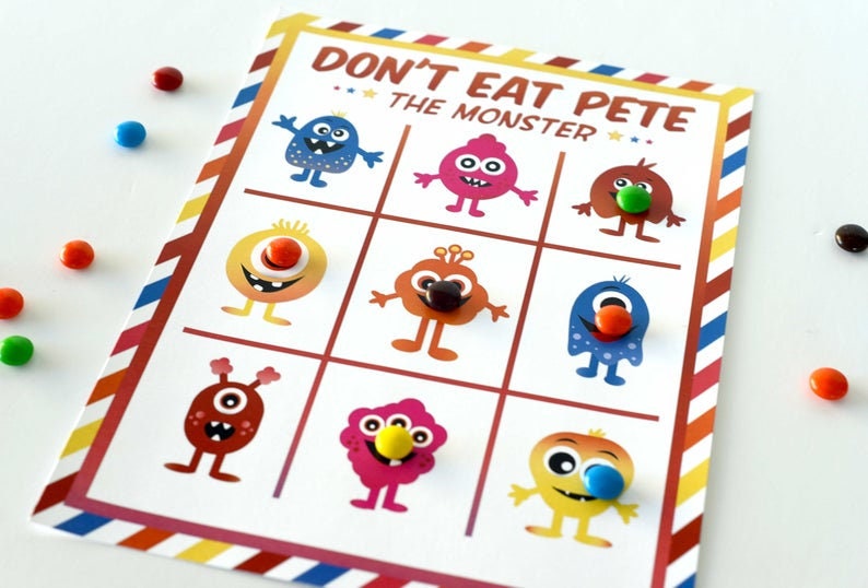 May include: A colorful game board with the title "Don't Eat Pete The Monster". The board has nine squares with different colored monsters in each square. Each monster has a candy on its nose.
