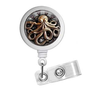 May include: White retractable badge holder with a round, white, plastic badge reel featuring a gold octopus with a steampunk design.