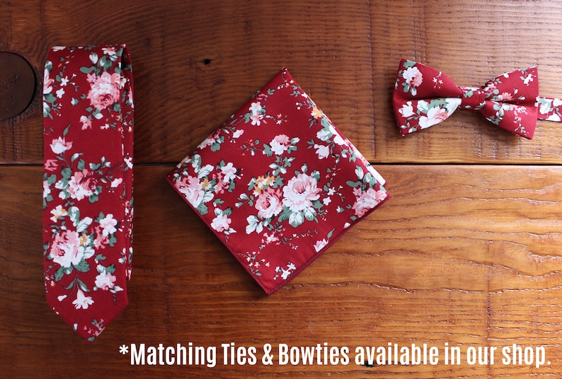 May include: A set of three matching accessories in a red floral pattern. The set includes a tie, a bow tie, and a pocket square.