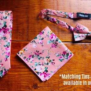 May include: A pink floral patterned tie, bow tie, and pocket square. The bow tie has a label that reads "Groomsman Bear". The text "Matching Ties & Bowties available in our shop." is at the bottom of the image.