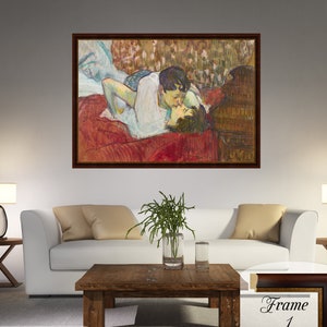 In Bed The Kiss by Henri de Toulouse Lautrec on a high-quality cotton canvas. The print comes in a wooden brown frame with a thin golden edge and it’s ready to hang.