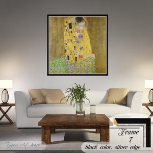 The Kiss by Gustav Klimt. Printed on a high-quality cotton canvas. The print comes in a wooden black frame with a thin silver edge and it’s ready to hang.