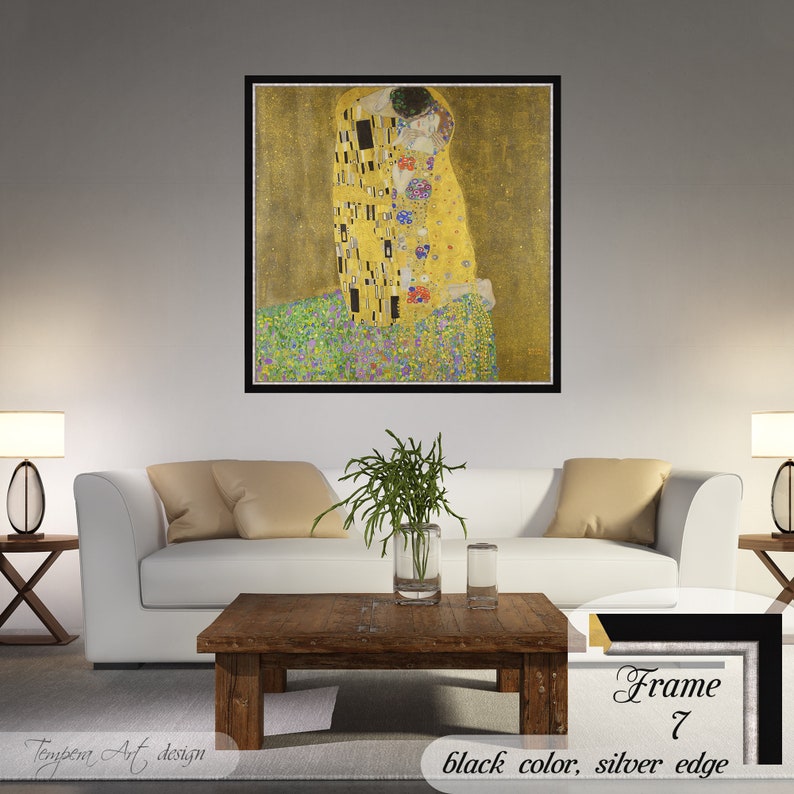 The Kiss by Gustav Klimt. Printed on a high-quality cotton canvas. The print comes in a wooden black frame with a thin silver edge and it’s ready to hang.