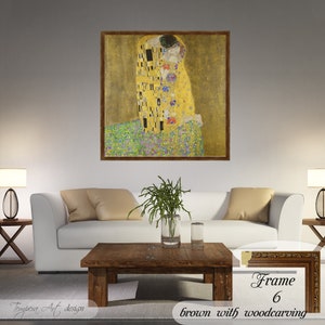 The Kiss by Gustav Klimt. Printed on a high-quality cotton canvas. The print comes in a wooden brown frame with a woodcarving effect and it’s ready to hang.