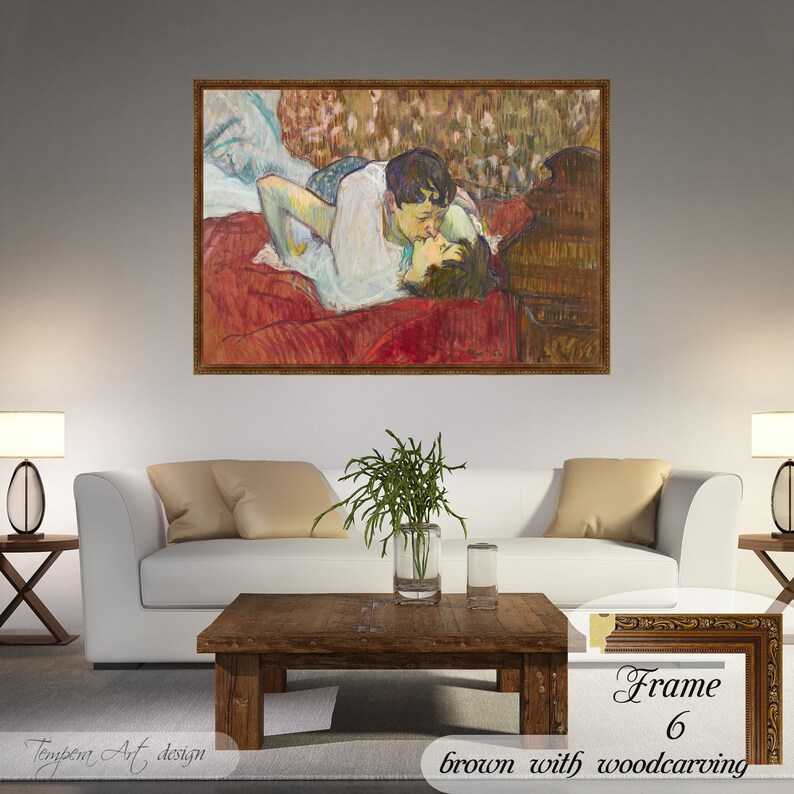 In Bed The Kiss by Henri de Toulouse Lautrec on a high-quality cotton canvas. The print comes in a wooden brown frame with a woodcarving effect and it’s ready to hang.