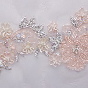 Hand-made motif with tender peach organza applique flowers