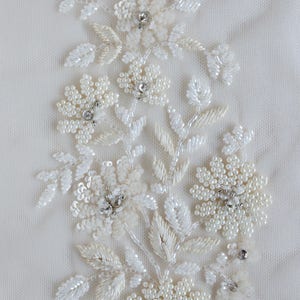 Diamond shaped hand-made motif with flowers of tiny pearls and sequins