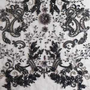 Tulle hand-embroidered in a beautiful black