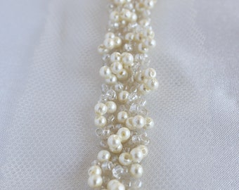 Hand-made trim with grape-like clusters of pearls and beads