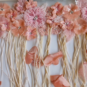Hand-beaded cornucopia of applique flowers and tassels
