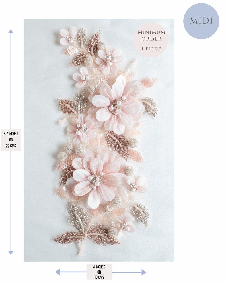 May include: A delicate floral applique with pink and white flowers, silver and gold beads, and leaves. The applique measures 8.7 inches tall and 4 inches wide. Minimum order is 1 piece.