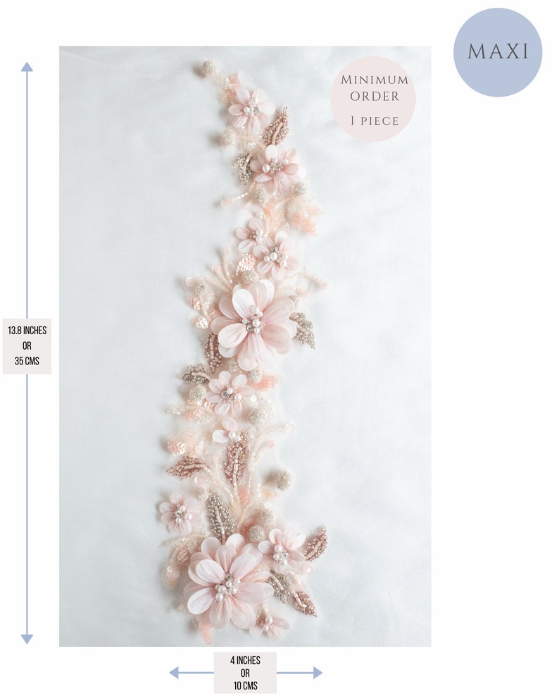 May include: A delicate floral applique with pink and white flowers and pearl accents. The applique measures 13.8 inches in length and 4 inches in width. Minimum order is 1 piece.