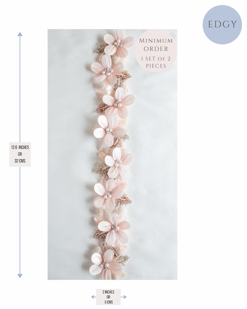 May include: A delicate pink floral trim with pearl accents, measuring 12.6 inches (32 cm) long and 2 inches (5 cm) wide. The trim is perfect for adding a touch of elegance to any project. Minimum order is 1 set of 2 pieces.