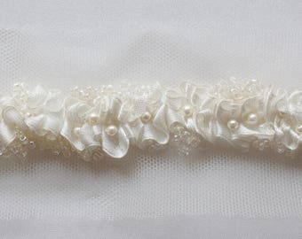 Hand-made trim with crushed satin ribbon and beads