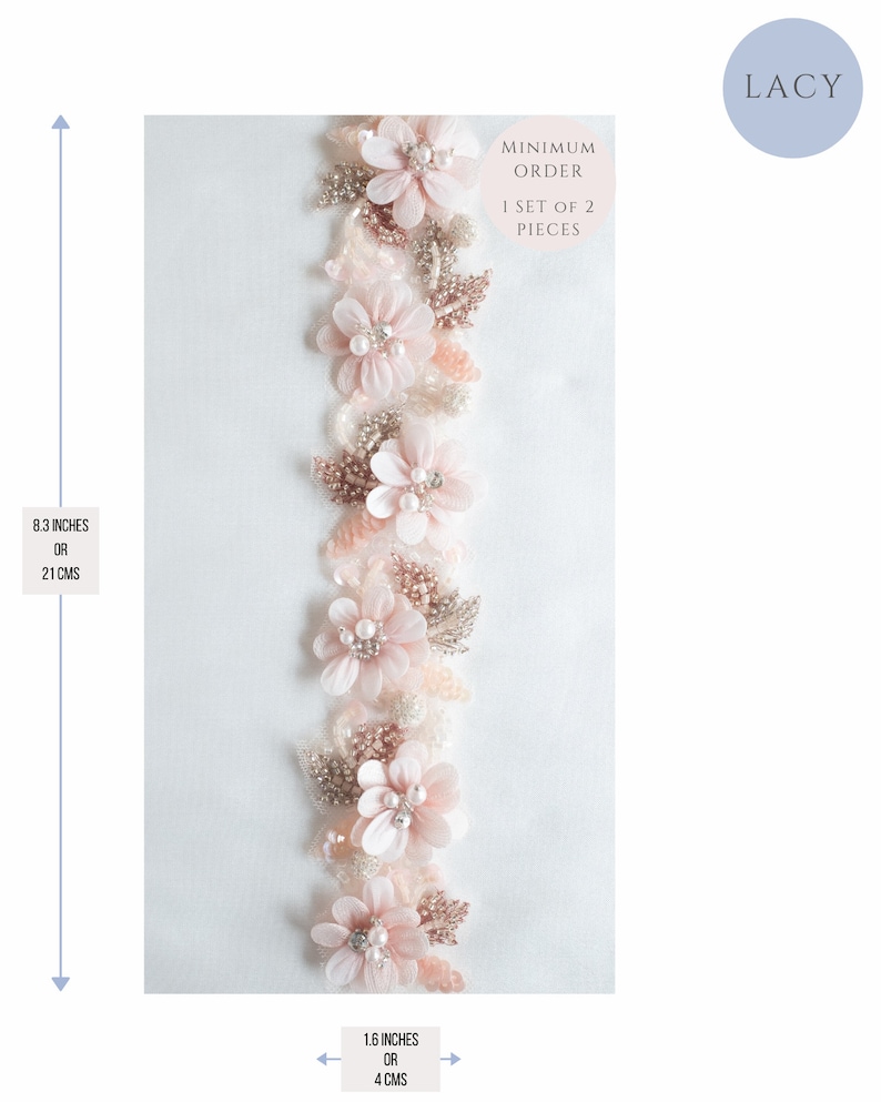 May include: A delicate pink and gold floral trim with a minimum order of 1 set of 2 pieces. The trim is 8.3 inches or 21 cm long and 1.6 inches or 4 cm wide.