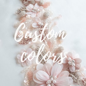 May include: Close-up of delicate pink floral embellishments with pearl accents. The text "Custom colors" is written in white on the image.  We make custom colors for a minimum order of 3 pieces.