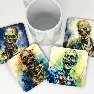 May include: Four square coasters featuring watercolour zombie illustrations. Each coaster depicts a different zombie in a green, grey and white colour scheme. The zombies have blood splatters and are in various poses.