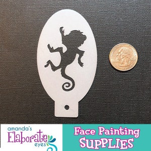 May include: A white face painting stencil with a black silhouette of a cartoon monkey. A U.S. quarter is next to the stencil for size comparison. The image also includes the text "Face Painting SUPPLIES".
