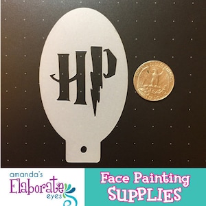 May include: A white plastic stencil with the letters "HP" and a lightning bolt, next to a quarter. The stencil is for face painting. The words "Face Painting SUPPLIES" are in the bottom right corner.
