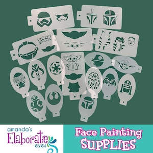 May include: A collection of white plastic stencils featuring Star Wars characters and symbols. Designs include Stormtroopers, Baby Yoda, Darth Vader, and the Rebel Alliance symbol. The text "Face Painting Supplies" is visible.