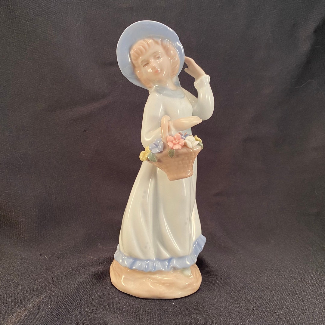 Elegant Porcelain Girl Figurine With Floral  Basket