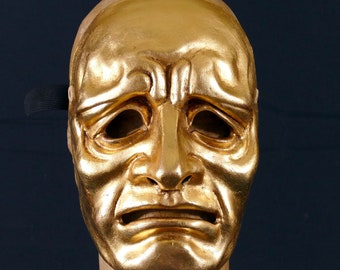sorrowful gold mask in papier maché