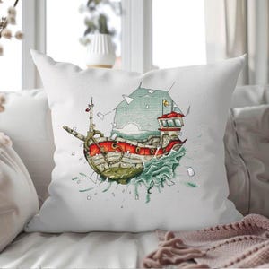 May include: White square throw pillow featuring a colorful illustration of a ship breaking through a wall. The ship has red and green accents, with blue water and sky details. Decorative pillow for home decor.